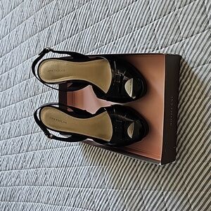 Black patent sling ball heels